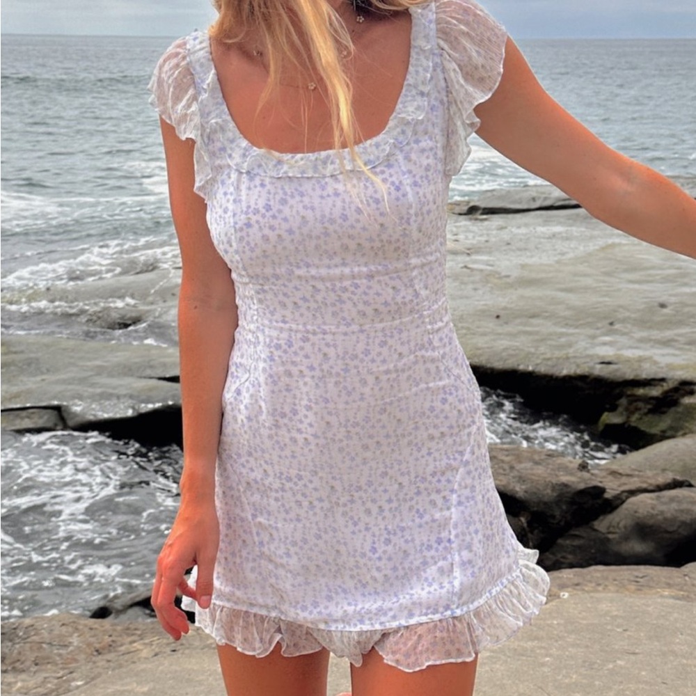 Floral White Dress with Ruffle Sleeves with Flower Detail